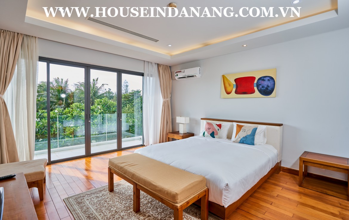 There are four nice bedrooms in the beachside villa rent Danang. As the below picture, bedrooms are quite airy with front windows. In addition, there has the warmly decoration with the wooden floor, wall paintings, gentle lights and the modern painting color in bedrooms. Besides, these bedrooms are quite airy with large windows viewing directly to the garden and the river. Or you can leisurely enjoy the peaceful beauty of the winding river meanders the villa area. So, it is great for you to get the fresh and admiring the peaceful and romantic life in the luxury Ocean villa compound. Moreover, there have been already full of Queen beds with soft mattresses, central air-conditioner systems, big wardrobes, and working table in bedrooms as well. Especially, the master bedroom is enough big to set up a small relaxing room inside and having an ensuite bathroom.